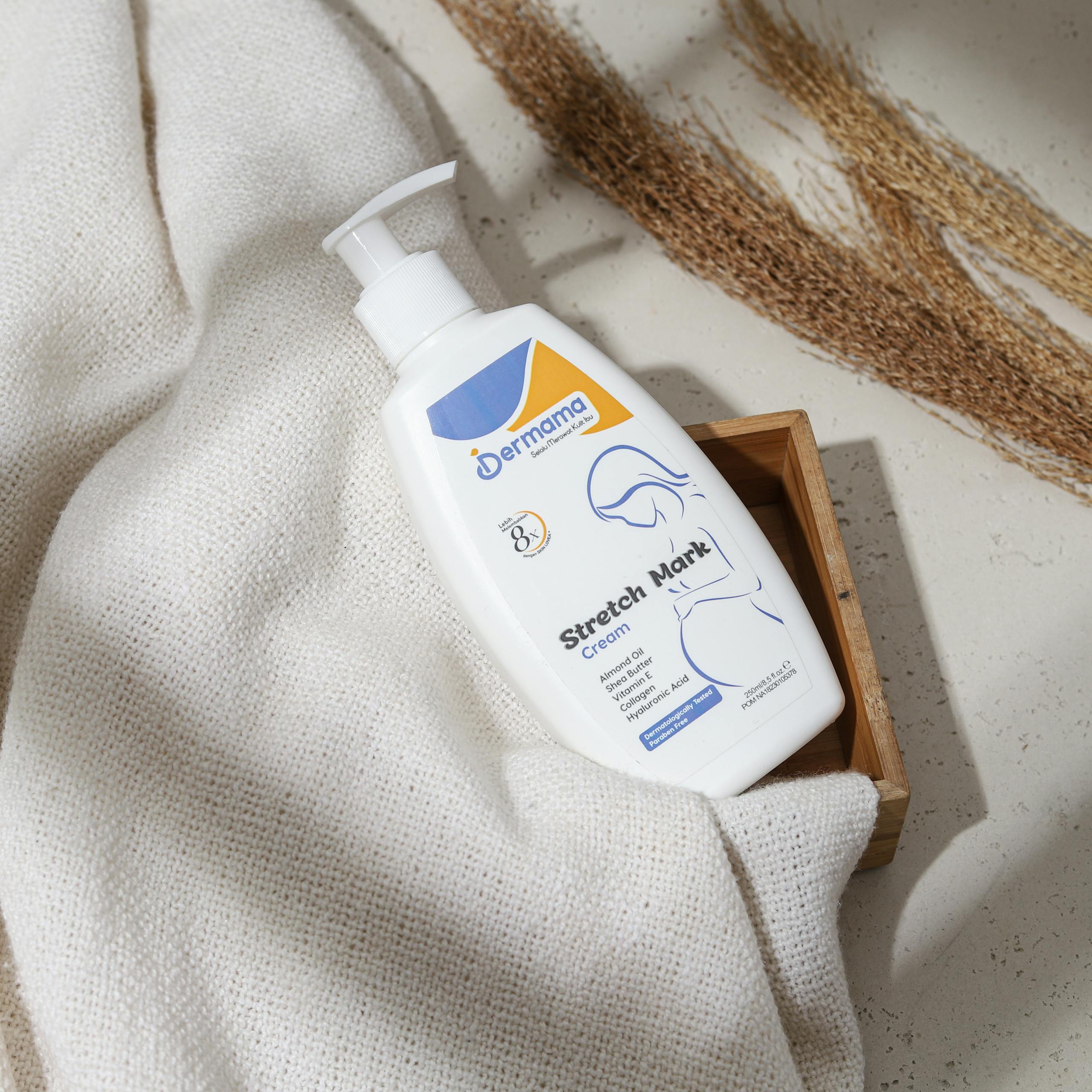 Elegantly presented stretch mark cream bottle with natural materials for skincare routines.